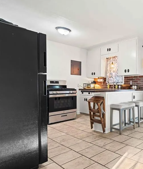 Kitchen layout before remodel showing original cabinets and countertops